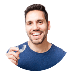 man inserting his clear aligners