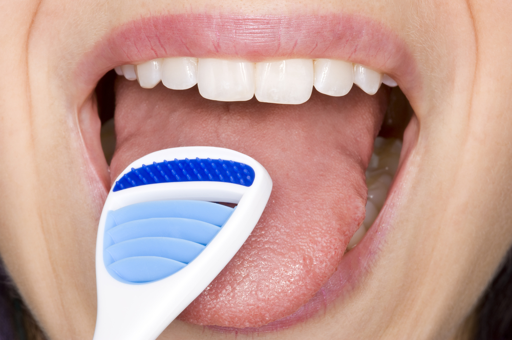 Importance Of Cleaning Your Tongue In Oral Hygiene - Odyssey Dental of