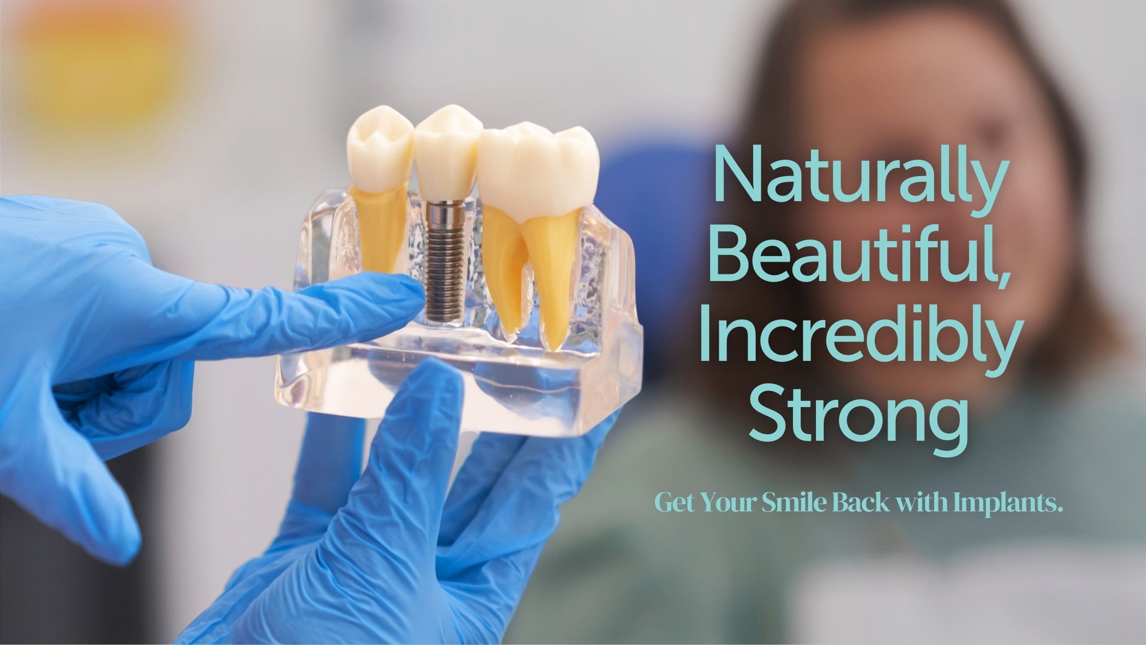 Dentist holding a dental implant model with the words naturally beautiful, incredibly strong.